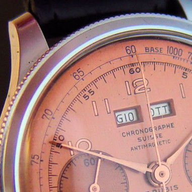Calendar chronographs with rotating bezel adjustment